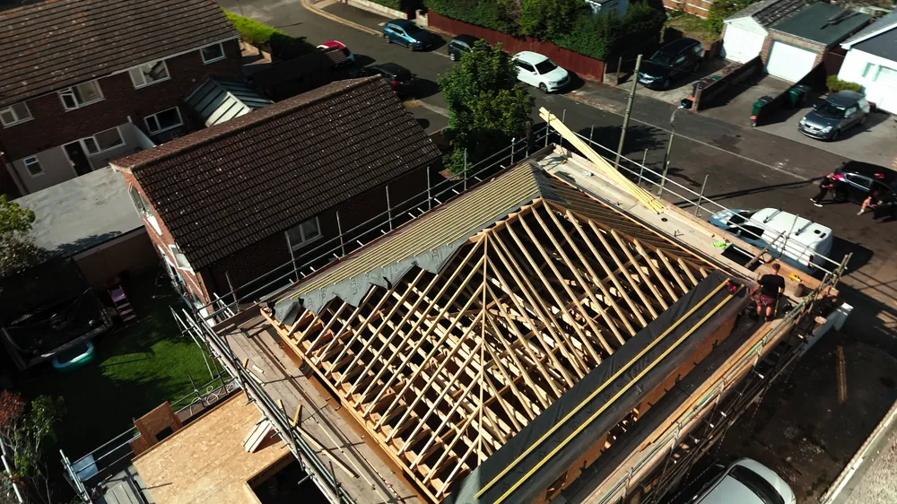 A Brighton bungalow from the air with its new timber roof structure going on
